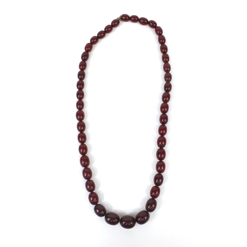 833 - Cherry amber coloured bead necklace, 70cm long, approximate weight 84.2g