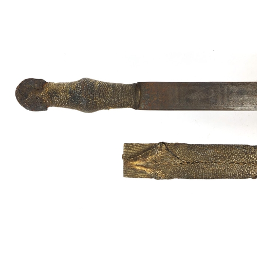334 - Middle Eastern steel sword with chased decoration, housed in a snakeskin case, the sword 88cm long
