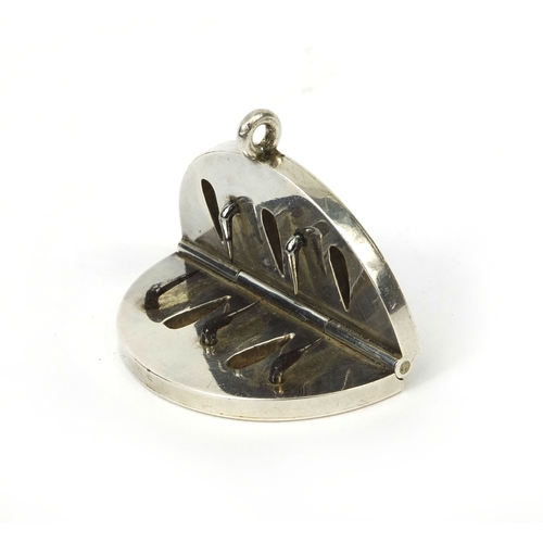 148 - 19th century silver coloured metal folding blood letting pendant, with engraved initials, 4.5cm in d... 