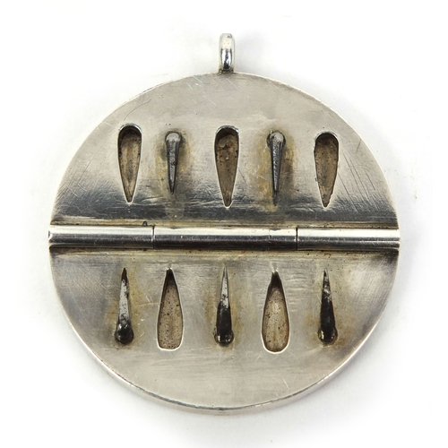 148 - 19th century silver coloured metal folding blood letting pendant, with engraved initials, 4.5cm in d... 