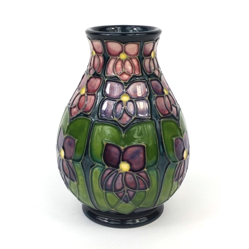 2066 - Boxed Moorcroft pottery Violet patterned vase, factory marks and initials to the base, the vase 13cm... 