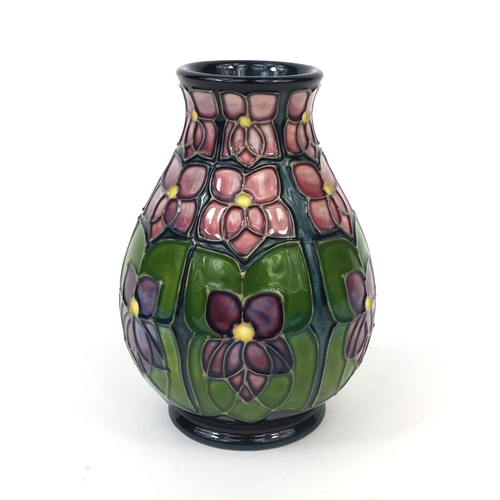 2066 - Boxed Moorcroft pottery Violet patterned vase, factory marks and initials to the base, the vase 13cm... 