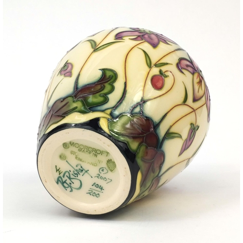 2059 - Boxed limited edition Moorcroft pottery Queens Meadow patterned vase, designed by RJ Bishop, factory... 