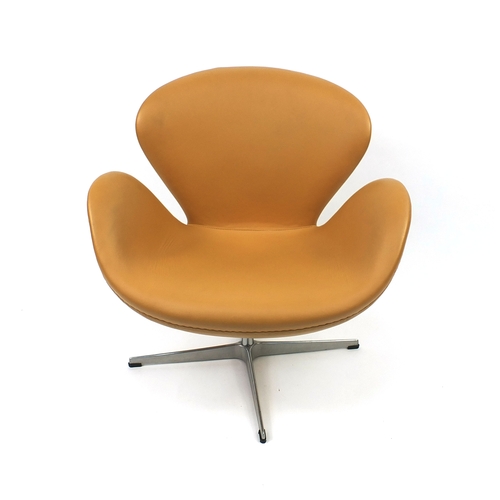 2014 - Arne Jacobsen design swan chair with leather upholstery, 75cm high