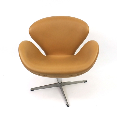 2013 - Arne Jacobsen design swan chair with leather upholstery, 75cm high