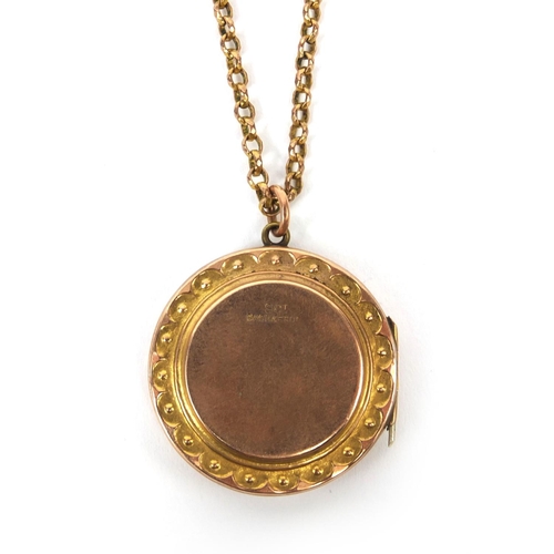 2493 - 9ct gold back and front floral locket engraved with flowers, on chain, approximate weight 9.6g