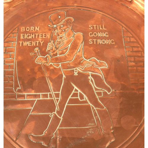 175 - Johnny Walker advertising embossed copper tray, 34cm in diameter