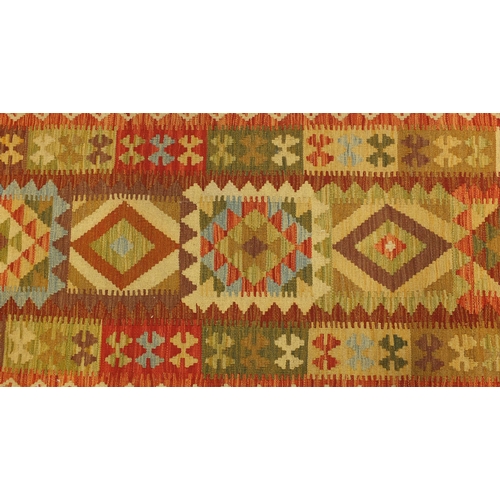 2012 - Rectangular Persian Kilim carpet runner, with an all over geometric design, 302cm x 84cm