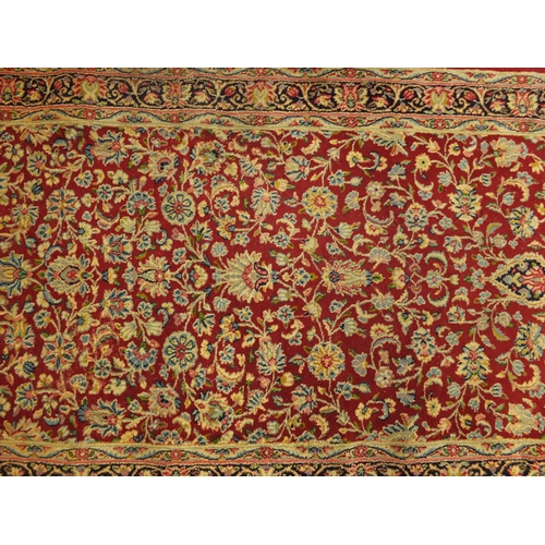 2022 - Large rectangular Persian Kerman carpet runner, the central field and boarders decorated all over wi... 