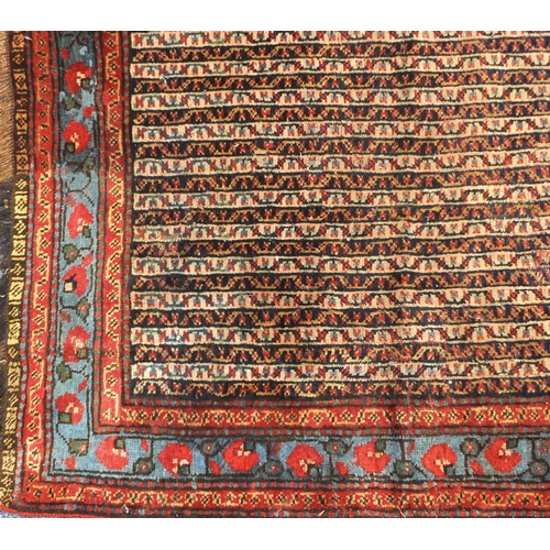 2019 - Rectangular Middle eastern rug, the central field decorated all over with stylised motifs within flo... 