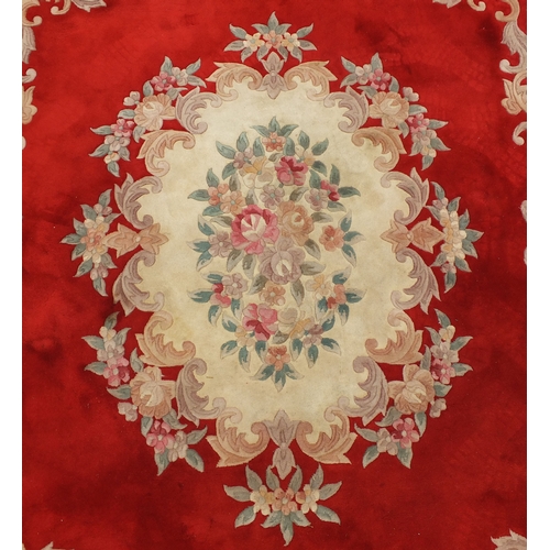 2015 - Large rectangular floral carpet onto a red ground, 340cm x 243cm