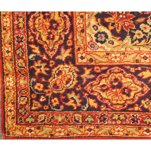 2006 - Rectangular Persian Kerman carpet, the central field and boarders with all over floral motifs onto a... 