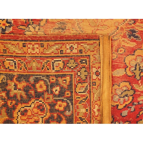 2006 - Rectangular Persian Kerman carpet, the central field and boarders with all over floral motifs onto a... 