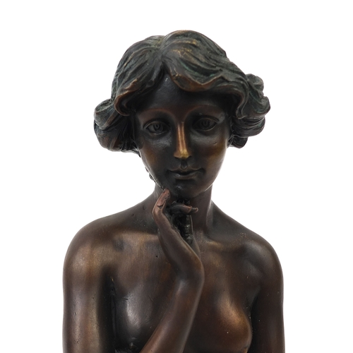 2057A - Bronze model of a nude female seated on a cushion, named 'Prof Caradossi', 25cm high