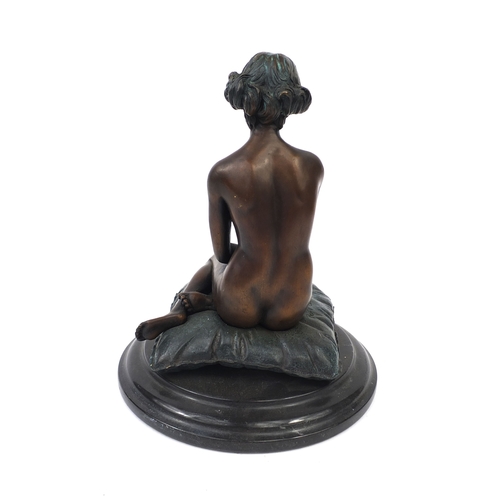 2057A - Bronze model of a nude female seated on a cushion, named 'Prof Caradossi', 25cm high