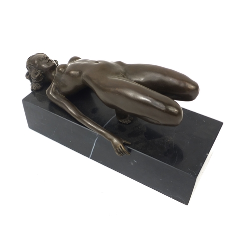 2103A - Bronze model of an erotic reclining nude female on a marble base, 12cm high