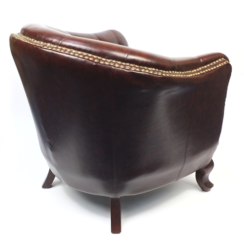 2009A - Pair of brown leather club chairs with horse shoe shaped back and button upholstery, 79cm high