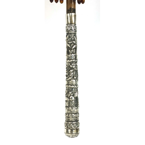 43 - Wooden parasol with silver handle, profusely embossed with Oriental figures in a village amongst flo... 