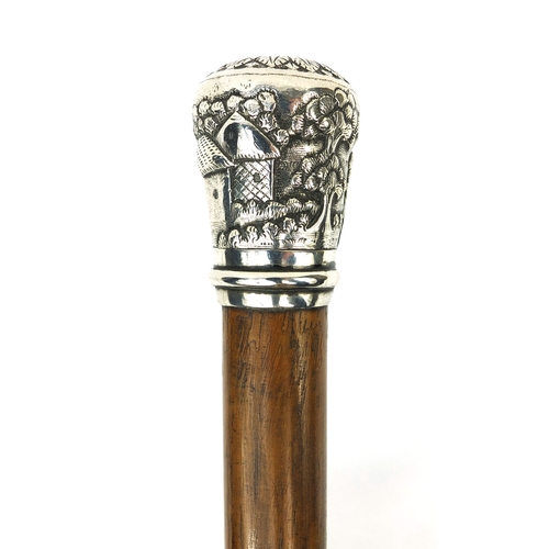 40 - Wooden walking stick with silver pommel, embossed with Oriental figures in village, 94cm long