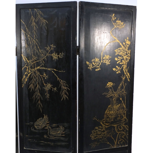 2007 - Oriental folding four section room divider, decorated in relief with pagodas and figures and animals... 