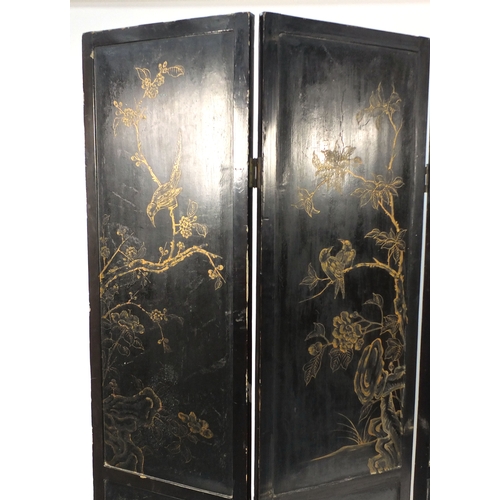 2007 - Oriental folding four section room divider, decorated in relief with pagodas and figures and animals... 