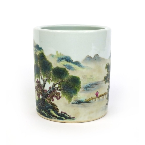 367 - Chinese porcelain cylindrical brush pot, hand painted in the famille rose palette with a river lands... 