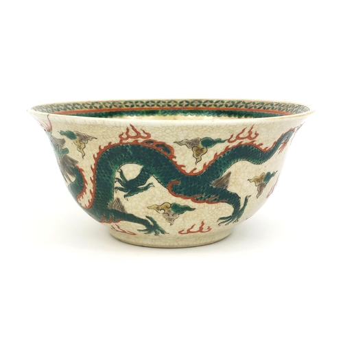 378 - Chinese crackle glazed stoneware bowl, hand painted in the famille verte palette with dragons chasin... 