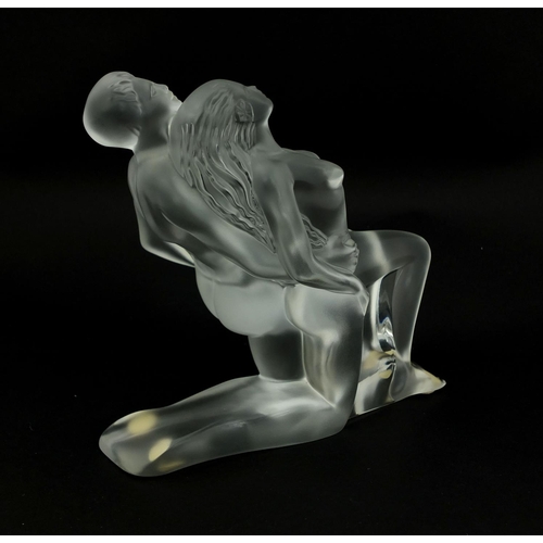 589 - Lalique frosted glass paperweight of two nude dancers, with original label, etched 'Lalique France' ... 