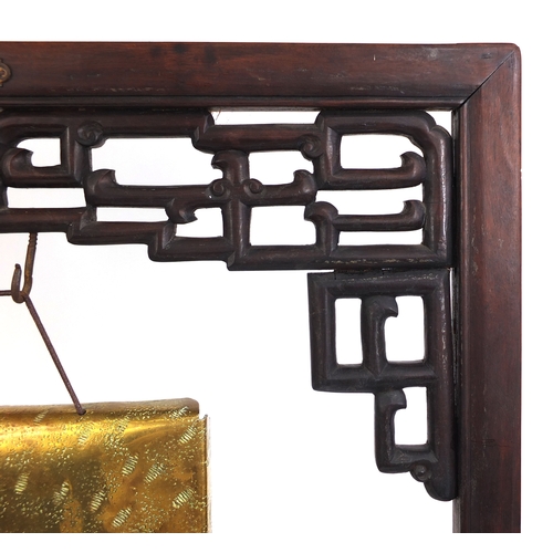 474 - Chinese carved hardwood dinner gong, with Townshend & Co brass gong, the hardwood frame with stylise... 