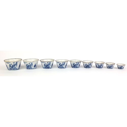 386 - Graduated set of nine Chinese blue and white porcelain bowls, each hand painted with a continuous ba... 