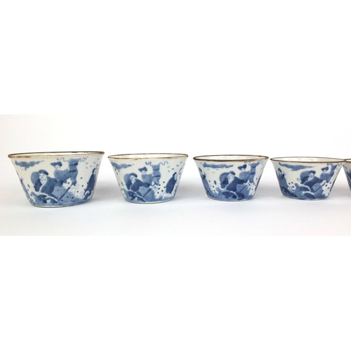 386 - Graduated set of nine Chinese blue and white porcelain bowls, each hand painted with a continuous ba... 