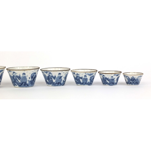 386 - Graduated set of nine Chinese blue and white porcelain bowls, each hand painted with a continuous ba... 