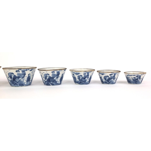 386 - Graduated set of nine Chinese blue and white porcelain bowls, each hand painted with a continuous ba... 