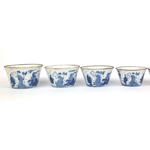 386 - Graduated set of nine Chinese blue and white porcelain bowls, each hand painted with a continuous ba... 