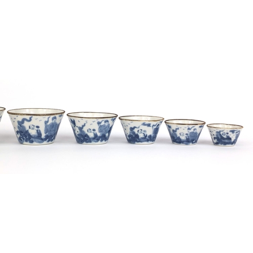 386 - Graduated set of nine Chinese blue and white porcelain bowls, each hand painted with a continuous ba... 