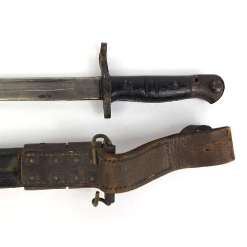 307 - American Military interest Remington 1917 pattern bayonet and scabbard the bayonet with wooden grip,... 