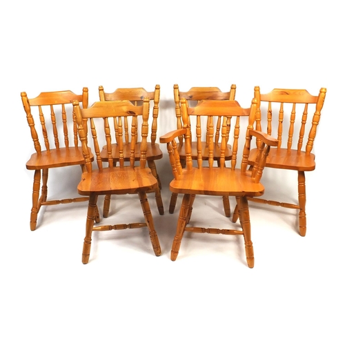 29 - Pine D-End extending dining table with six chairs including a carver, the table 74cm high x 143cm wi... 