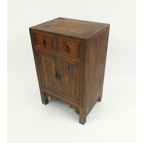 16 - Oriental hardwood side cabinet fitted with two drawers above two cupboard doors, 86cm high x 54cm wi... 
