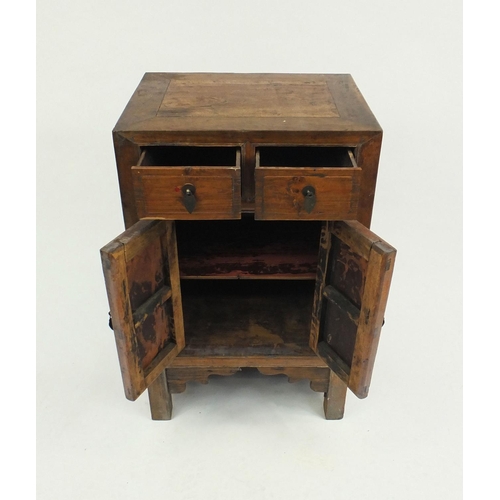 16 - Oriental hardwood side cabinet fitted with two drawers above two cupboard doors, 86cm high x 54cm wi... 
