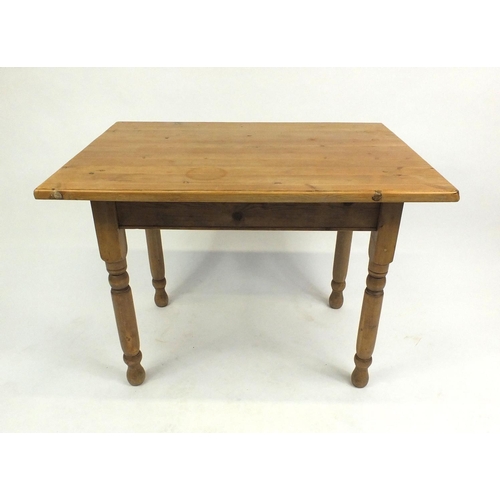 52 - Rectangular pine kitchen table on tuned legs, 74cm high x 99cm wide x 71cm deep