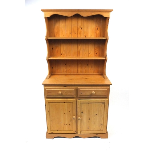 5 - Pine dresser fitted with an open plate rack above a pair of cupboard doors and drawers, 186cm high x... 