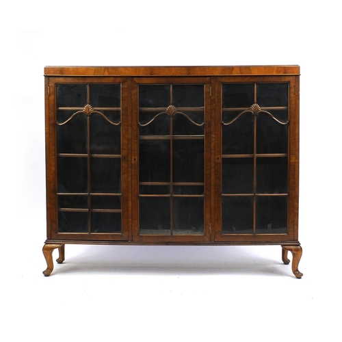 1 - 1930's Walnut bookcase with three glazed doors enclosing adjustable shelves with shell mouldings 115... 