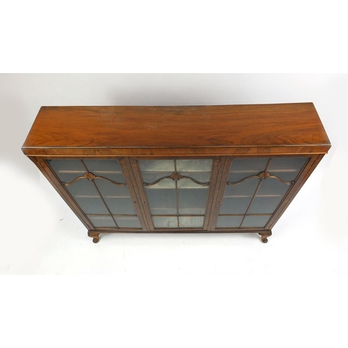 1 - 1930's Walnut bookcase with three glazed doors enclosing adjustable shelves with shell mouldings 115... 