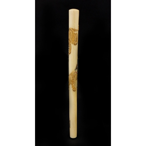 462 - Japanese ivory parasol handle of cylindrical tapering form, carved with two tigers, with attached pa... 