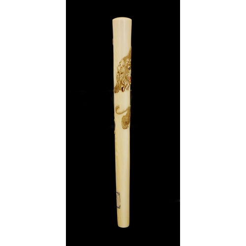 463 - Japanese ivory parasol handle of oval tapering form, carved with two tigers, with attached paper lab... 