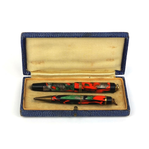 66 - Vintage Chic marbleised miniature fountain pen and propelling pencil housed in a fitted case, the fo... 