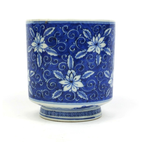 392 - Chinese blue and white porcelain brush pot, hand painted with flowers amongst foliate scrolls, six f... 