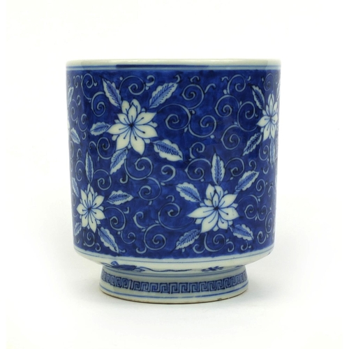 392 - Chinese blue and white porcelain brush pot, hand painted with flowers amongst foliate scrolls, six f... 