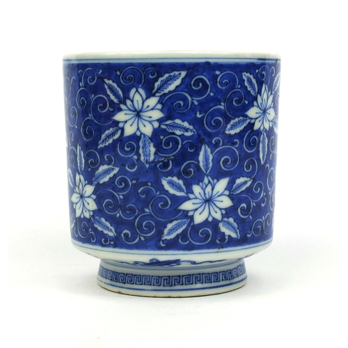 392 - Chinese blue and white porcelain brush pot, hand painted with flowers amongst foliate scrolls, six f... 