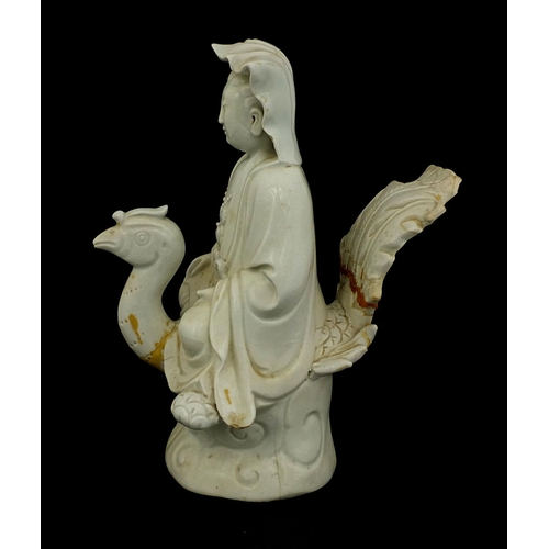 424 - Chinese Blanc de Chine porcelain figure of Guang Ying riding a phoenix, 25cm high